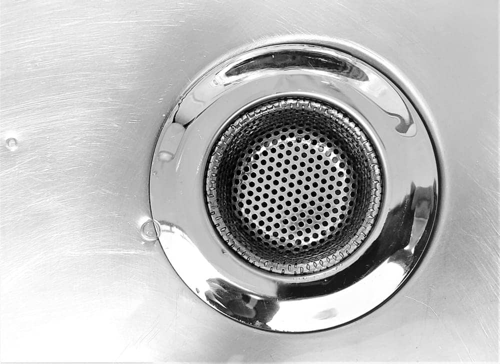 Close-up of a clean stainless sink drain