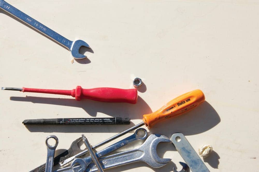 Wrenches and drivers laid out before a repair